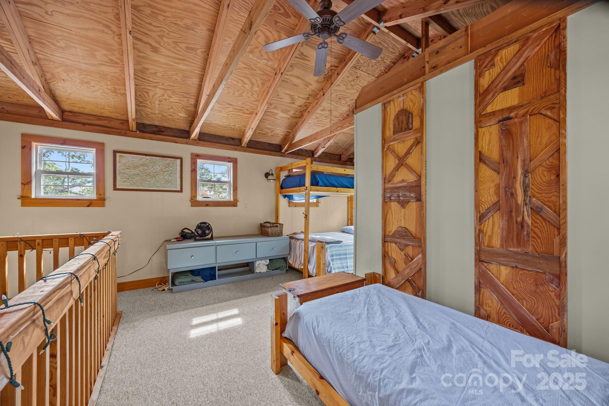 38 Buzzards Rst Trail, Unit 7 Saluda, NC 28773 - Photo 35 of 47 a bedroom with furniture and a window