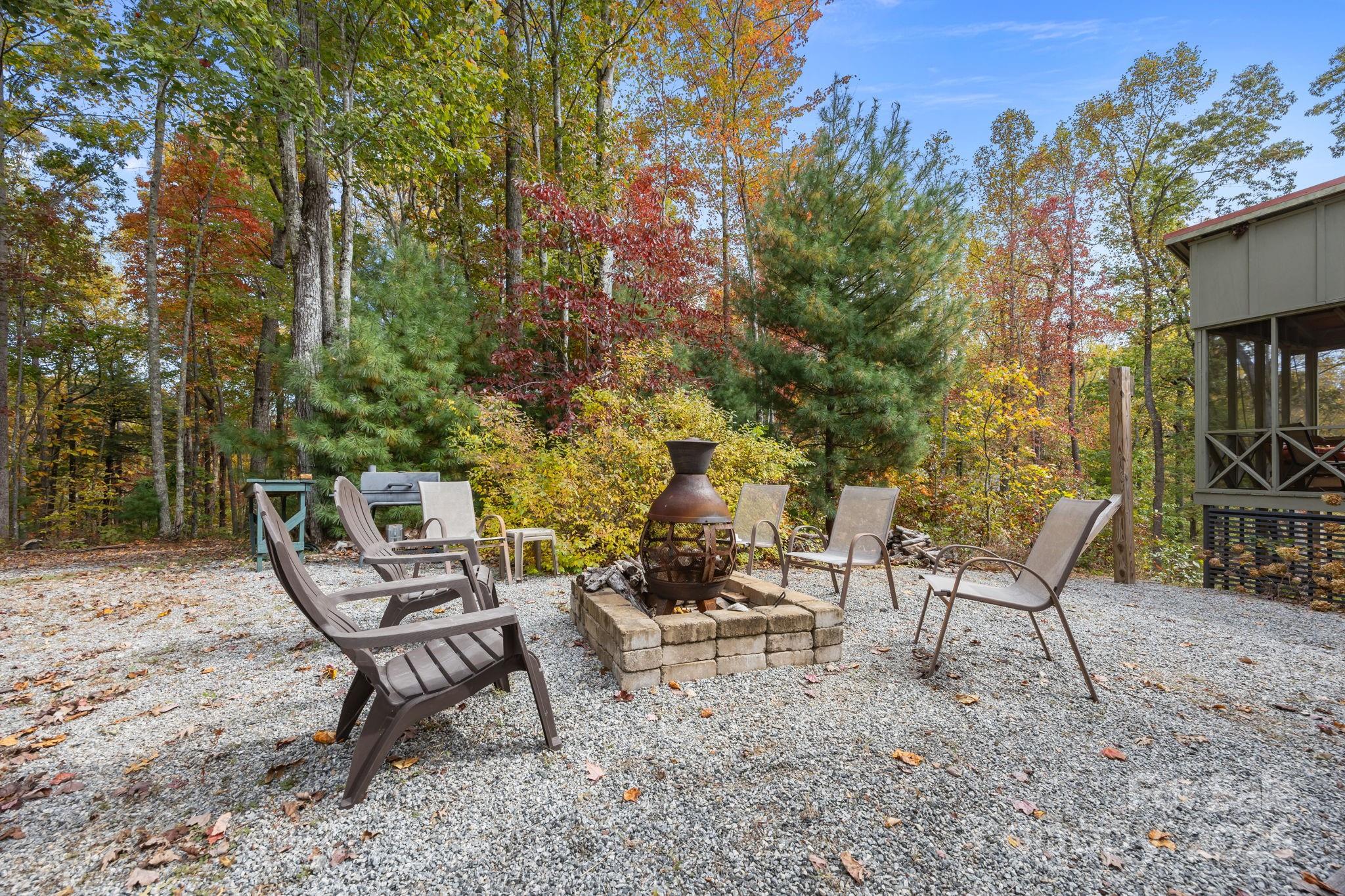 38 Buzzards Rst Trail, Unit 7 Saluda, NC 28773 - Photo 7 of 47 a chairs and a table in a backyard