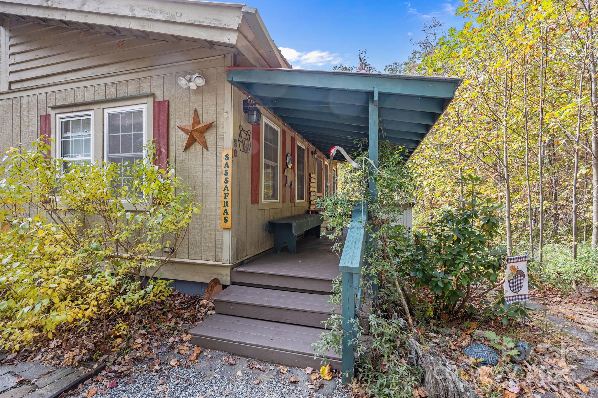 38 Buzzards Rst Trail, Unit 7 Saluda, NC 28773 - Photo 8 of 47 a view of a house with backyard and sitting area