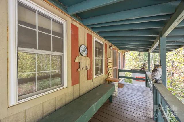 a view of a balcony with wooden floor