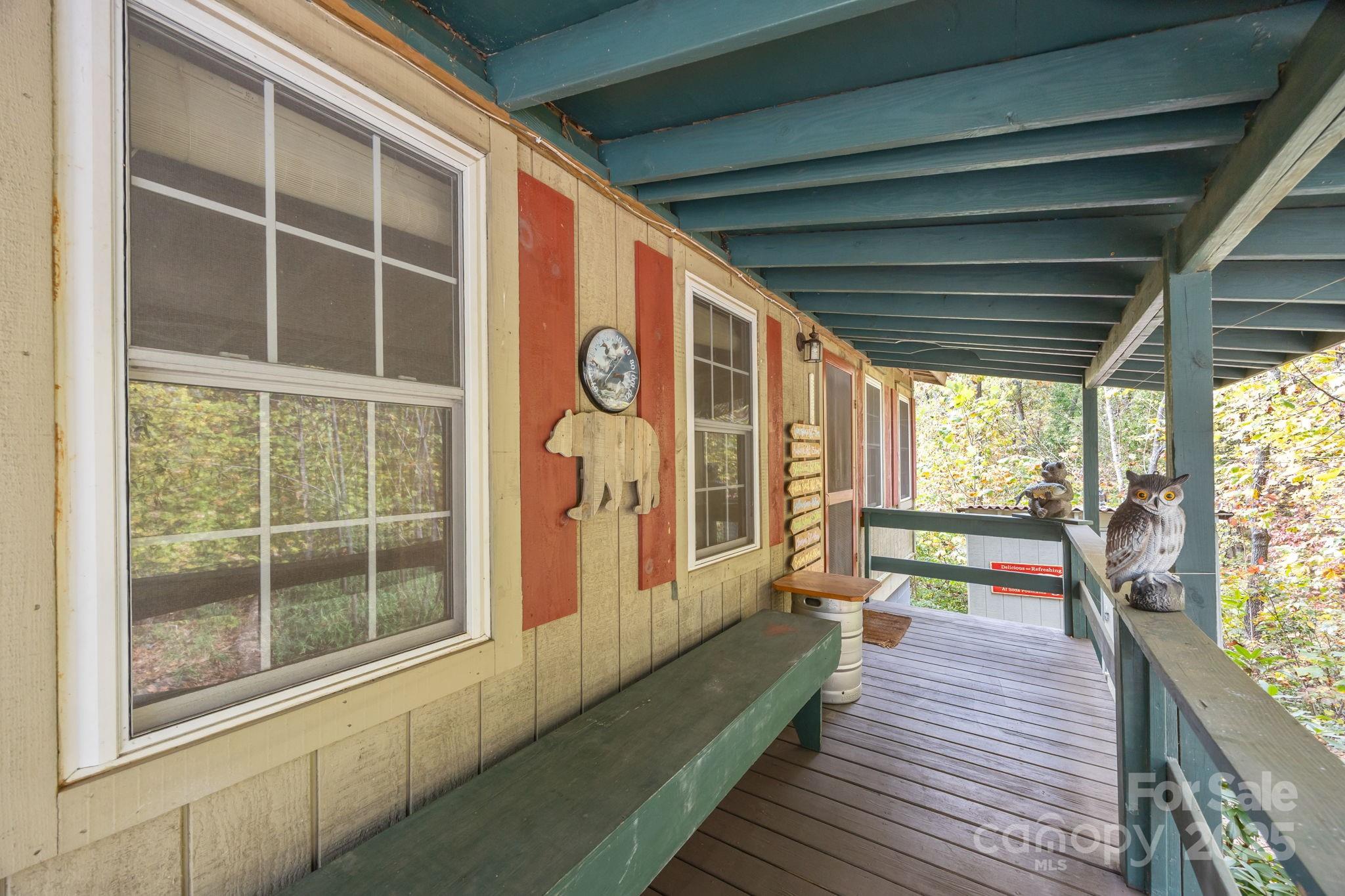 38 Buzzards Rst Trail, Unit 7 Saluda, NC 28773 - Photo 9 of 47 a view of a balcony with wooden floor