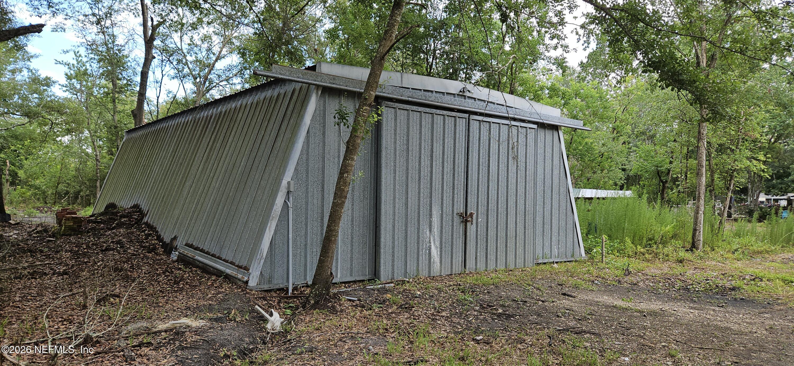 5363 Kilcrease Road Jacksonville, FL 32234 - Photo 19 of 29 a backyard of a house with lots of green space