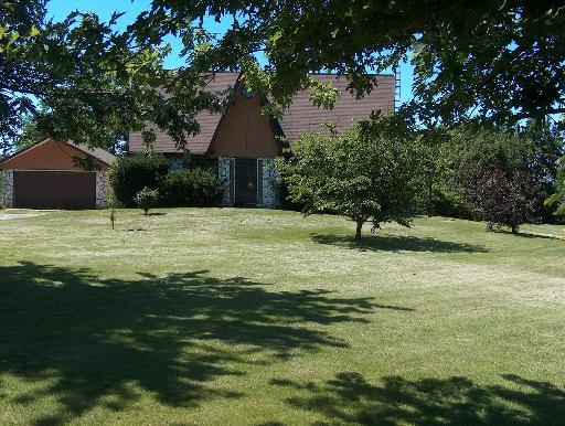 907 Moffet Road Paw Paw, IL 61353 - Photo 1 of 1 a swimming pool with trees in the background