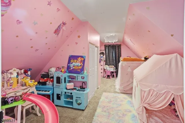 a bedroom with a bed and a desk