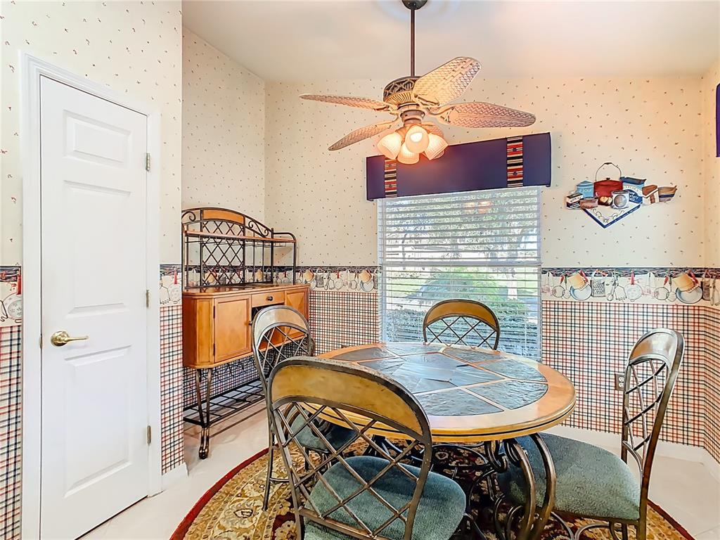 121 Rialto Road Poinciana, FL 34759 - Photo 15 of 68 a view of a dining room with furniture