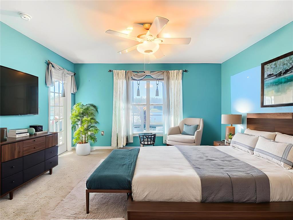 121 Rialto Road Poinciana, FL 34759 - Photo 20 of 68 a bedroom with a bed and a flat screen tv