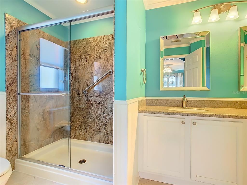 121 Rialto Road Poinciana, FL 34759 - Photo 24 of 68 a bathroom with a shower and a sink