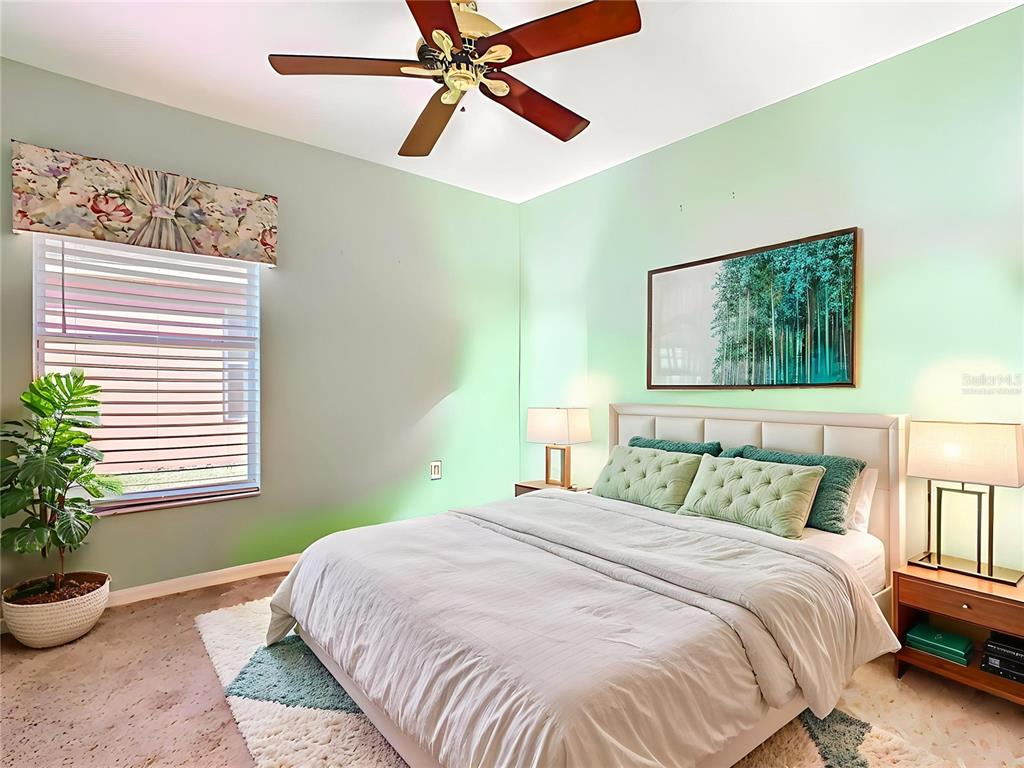 121 Rialto Road Poinciana, FL 34759 - Photo 27 of 68 a bedroom with a bed and a window