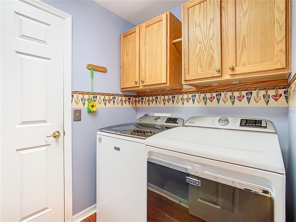 121 Rialto Road Poinciana, FL 34759 - Photo 31 of 68 a utility room with dryer and washer