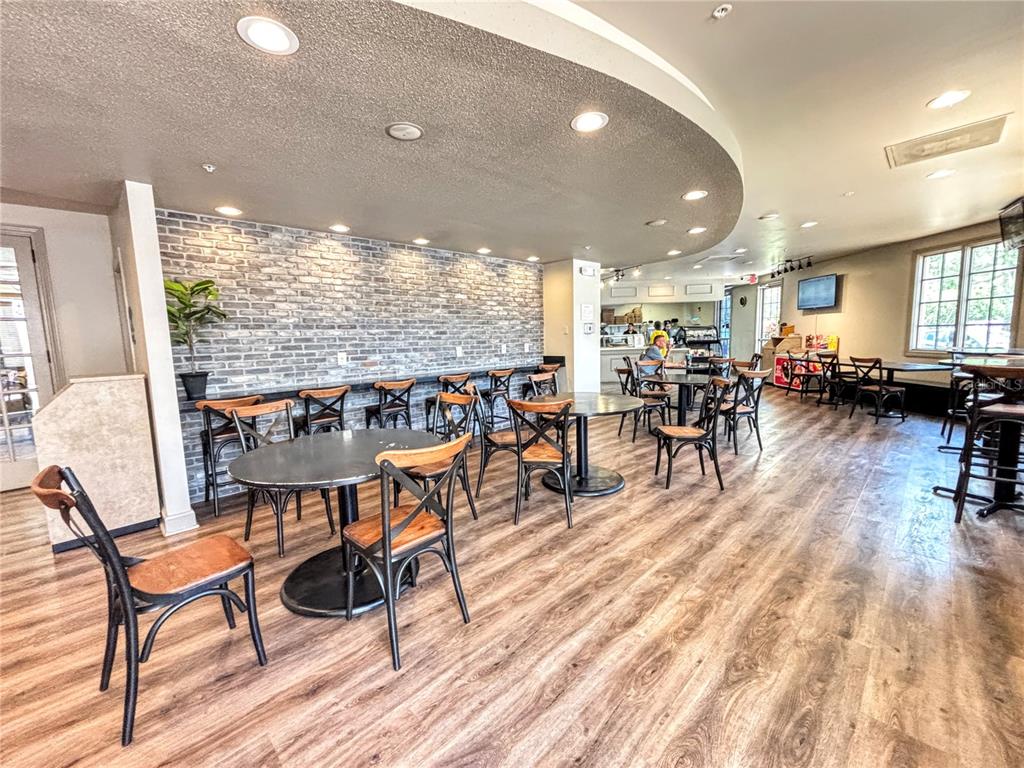121 Rialto Road Poinciana, FL 34759 - Photo 55 of 68 a view of a a dining room with furniture window and wooden floor