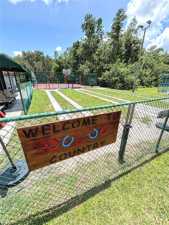 121 Rialto Road Poinciana, FL 34759 - Photo 64 of 68 swimming view of a wooden deck with a yard
