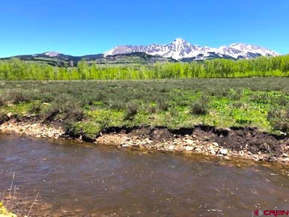 Tbd Forest Service Road 611 Road Placerville, CO 81430 - Photo 8 of 20 a view of a lake with sunset