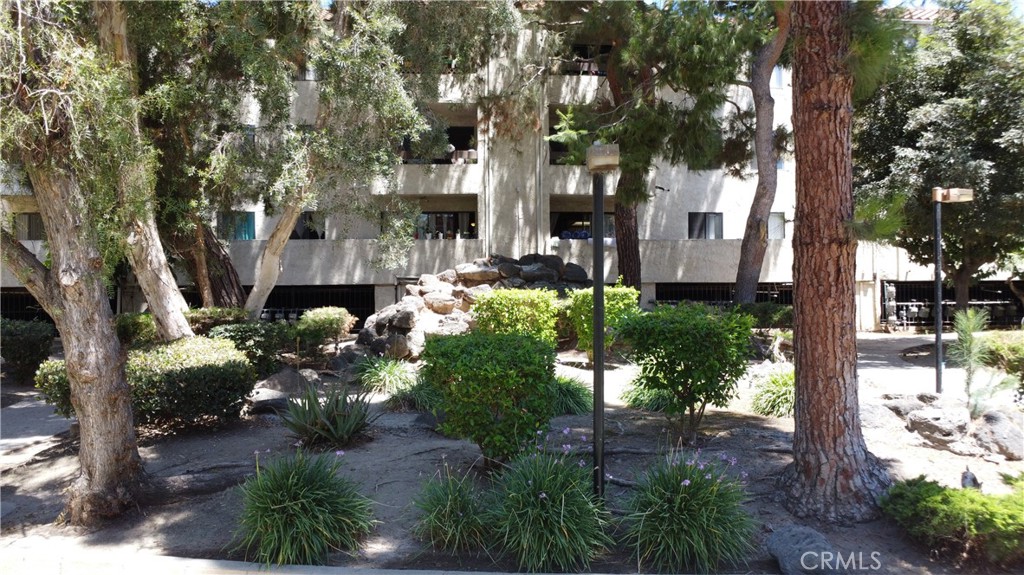 600 West 3rd Street, Unit B211 Santa Ana, CA 92701 - Photo 19 of 21 a front view of a house with a yard