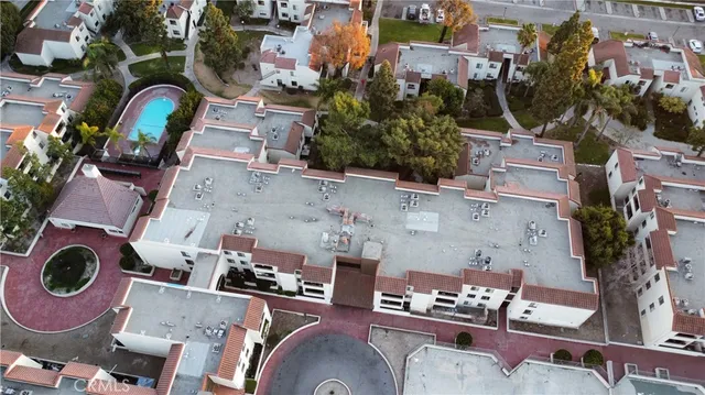 an aerial view of residential house with outdoor space and parking