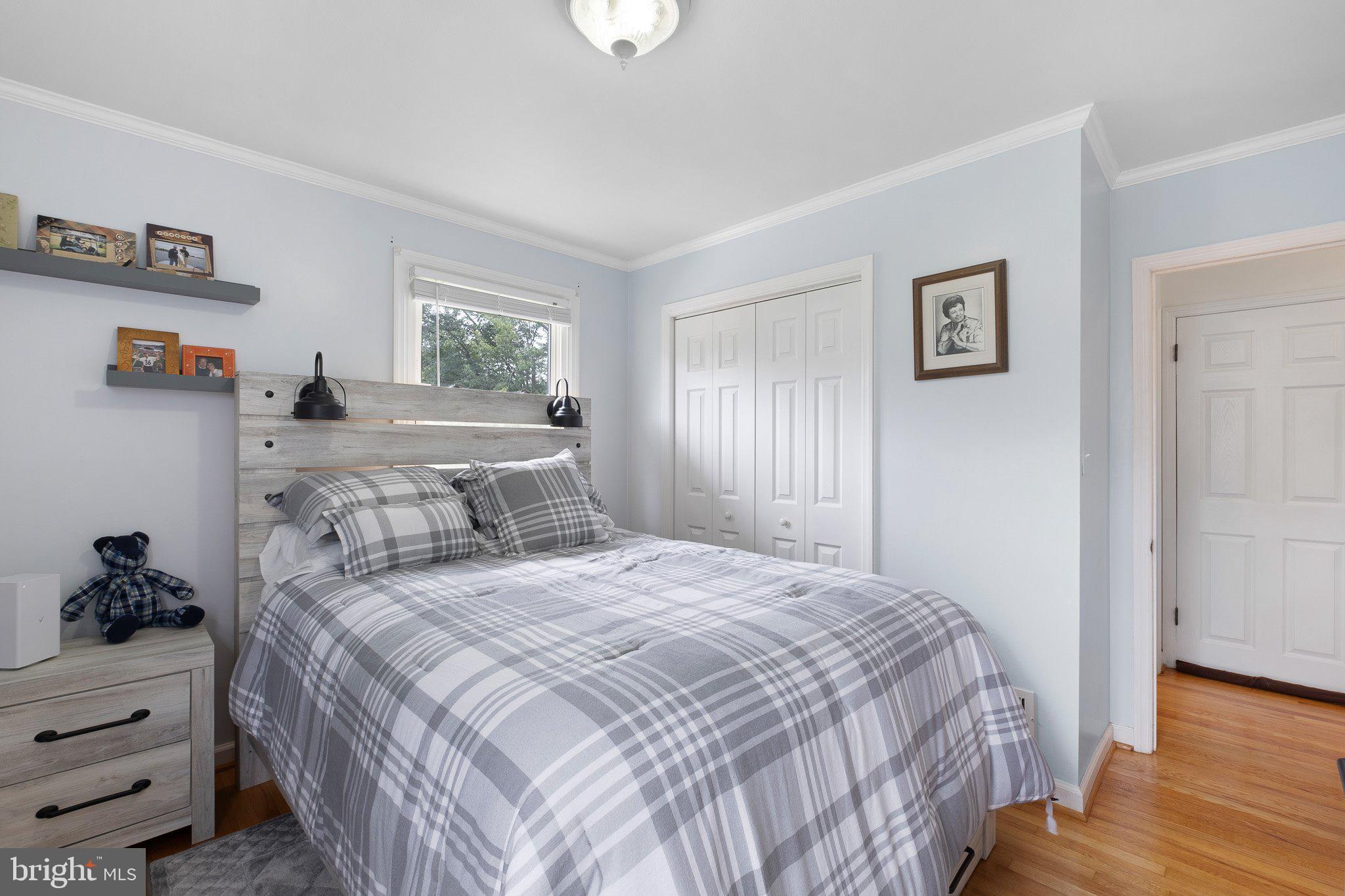603 Milltown Road Wilmington, DE 19808 - Photo 12 of 28 a bedroom with a bed and wooden floor