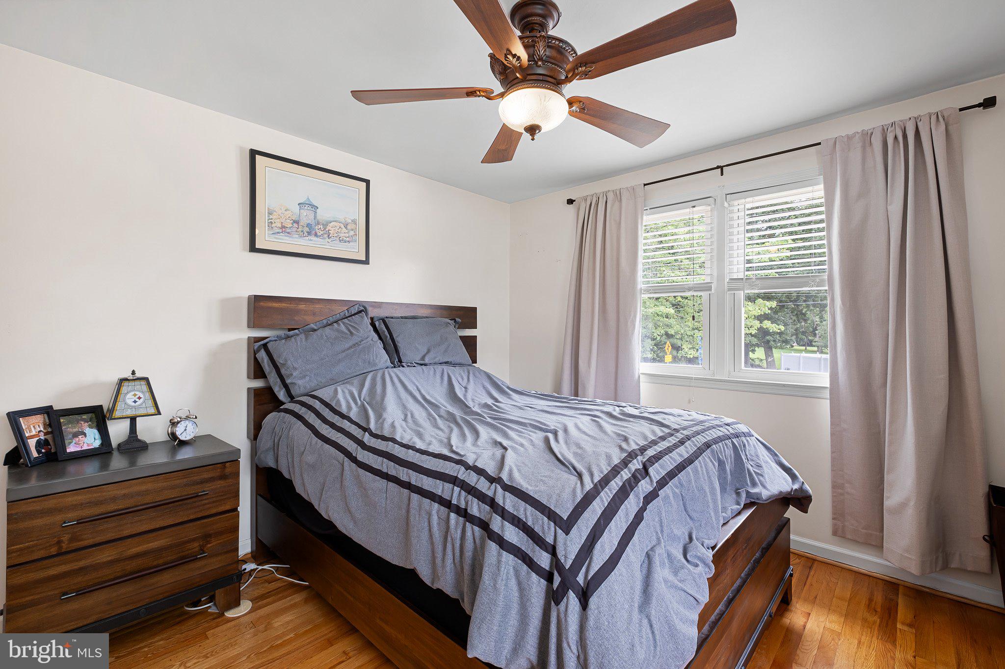 603 Milltown Road Wilmington, DE 19808 - Photo 15 of 28 a bedroom with a bed and a chandelier