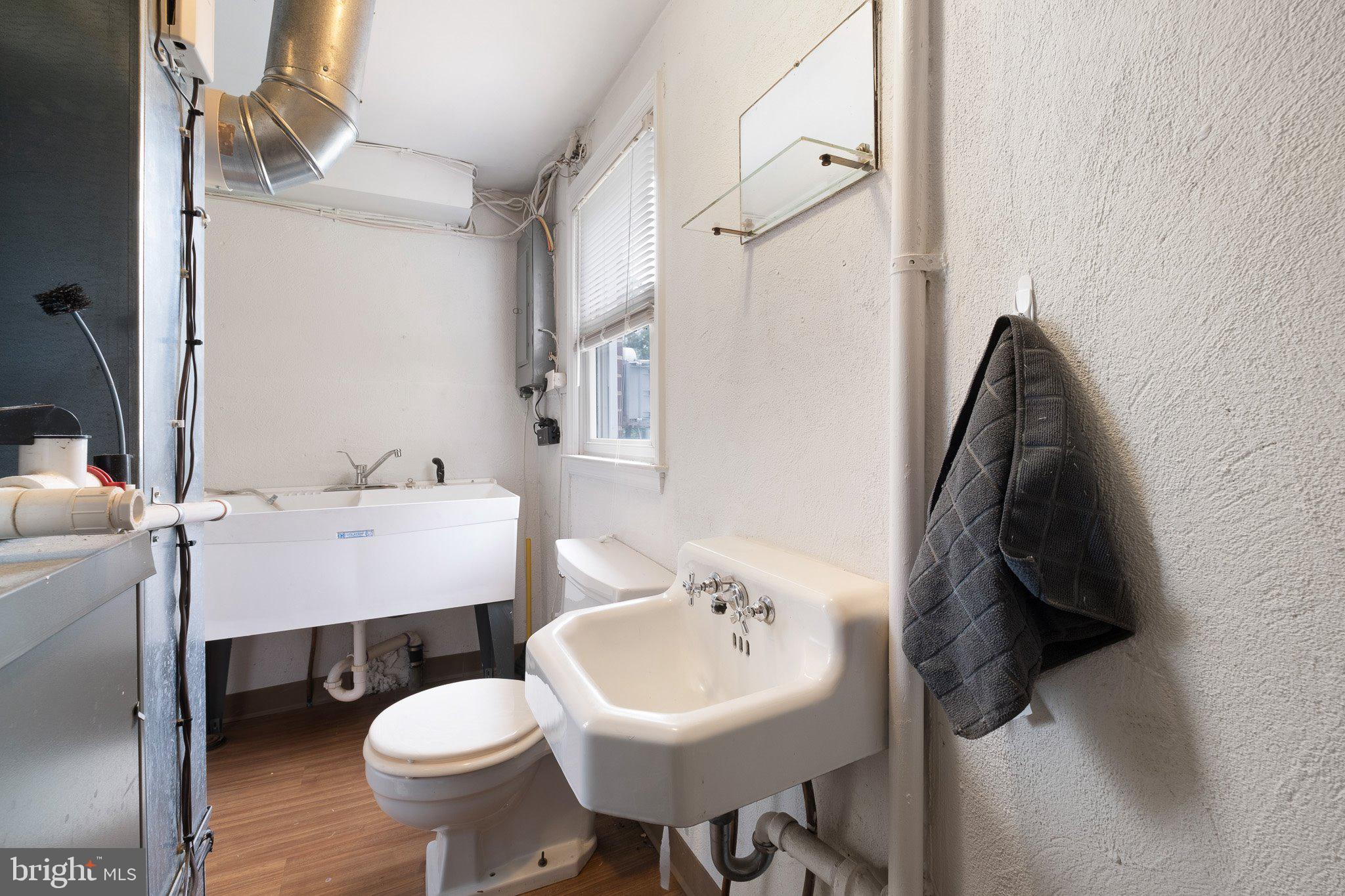 603 Milltown Road Wilmington, DE 19808 - Photo 17 of 28 a bathroom with a sink toilet and a mirror