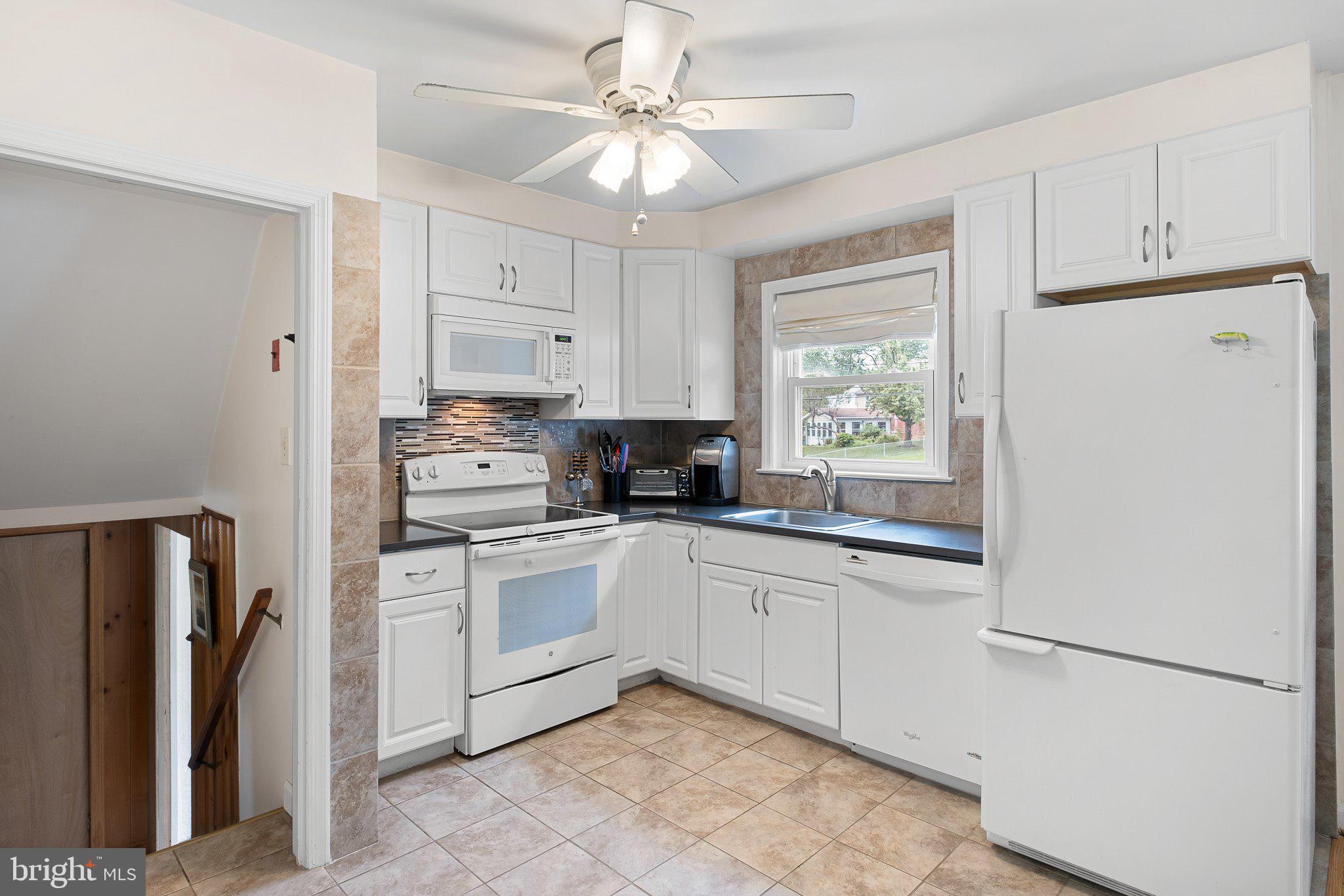 603 Milltown Road Wilmington, DE 19808 - Photo 7 of 28 a kitchen with stainless steel appliances granite countertop a refrigerator sink and cabinets