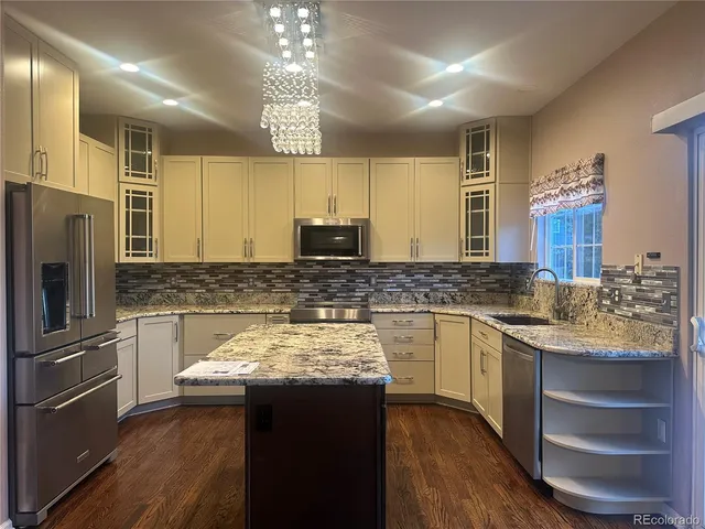 a kitchen with a sink and refrigerator