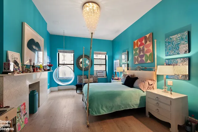 a bathroom with a double vanity sink toilet mirror and window