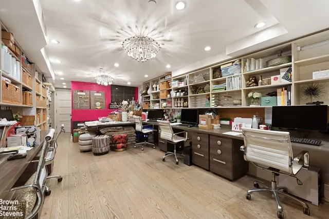 a bedroom with a bed wooden floor and window