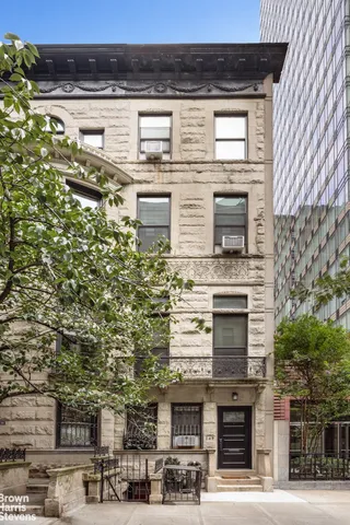 a view of a brick building from a balcony