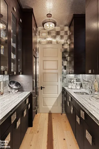 a dining room with furniture a chandelier and window