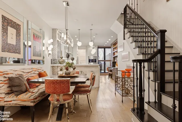 a living room with fireplace furniture and a flat screen tv