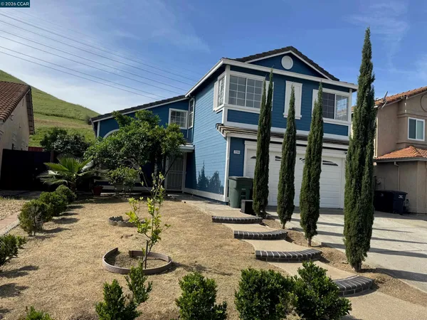 a front view of house with yard outdoor seating and entertaining space