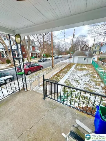 a view of a porch and garden