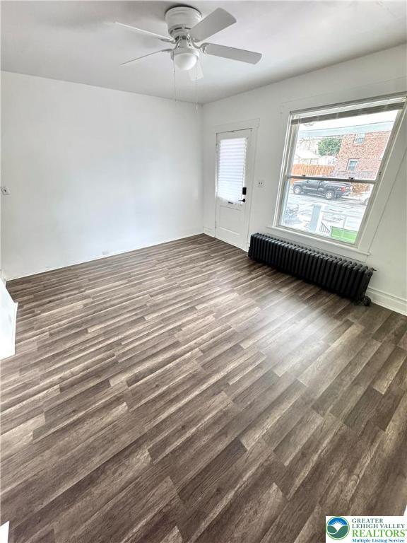 640 10th Avenue Bethlehem, PA 18018 - Photo 3 of 18 an empty room with wooden floor chandelier fan and windows