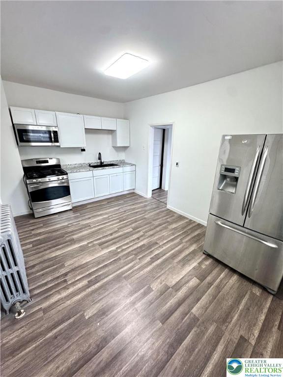640 10th Avenue Bethlehem, PA 18018 - Photo 6 of 18 a kitchen with stainless steel appliances granite countertop a refrigerator and a stove top oven