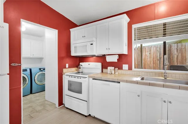 a kitchen that has a sink and a stove