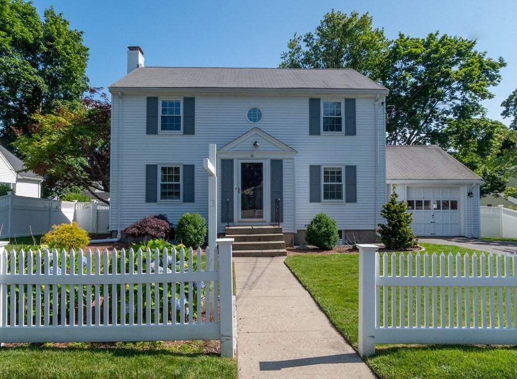 12 Longfellow Road Needham, MA 02494 - Photo 1 of 16 a front view of a house with a yard