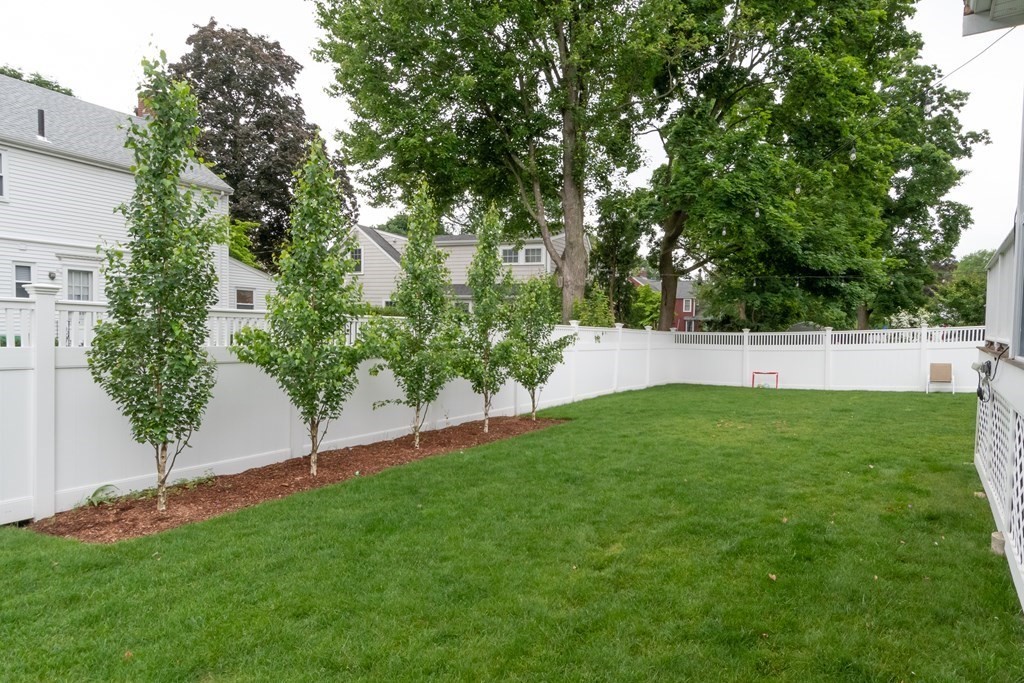 12 Longfellow Road Needham, MA 02494 - Photo 14 of 16 a view of green field with trees in the background