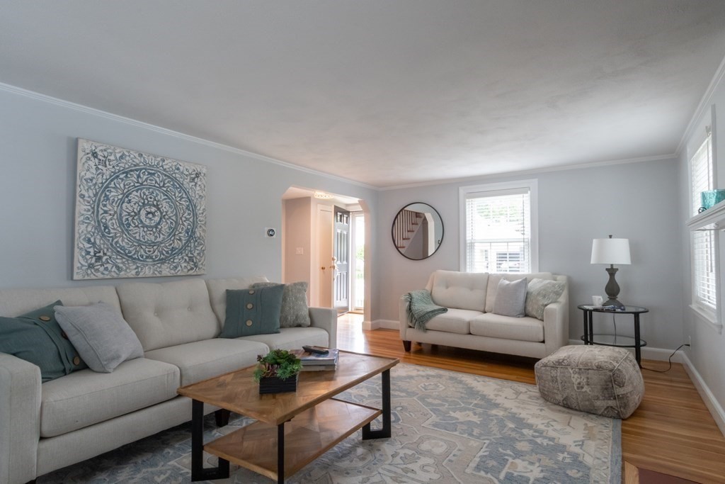 12 Longfellow Road Needham, MA 02494 - Photo 2 of 16 a living room with furniture and a large window