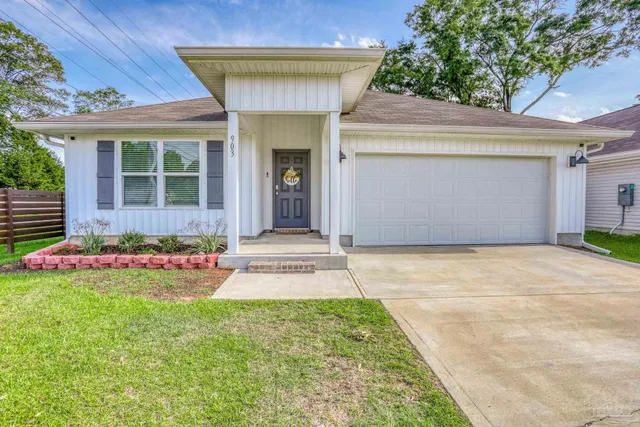 a front view of a house with a yard and porch