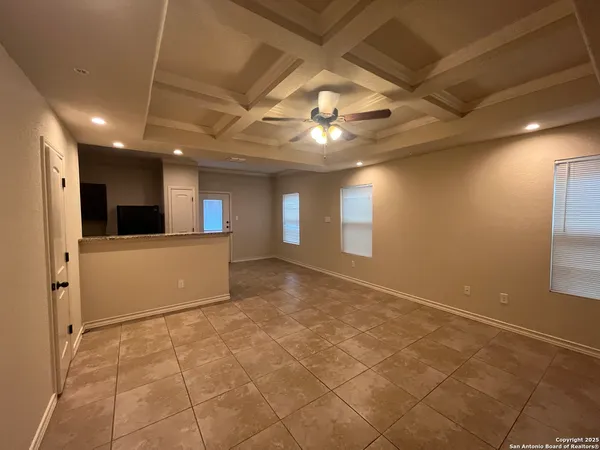 a view of a hallway with a kitchen