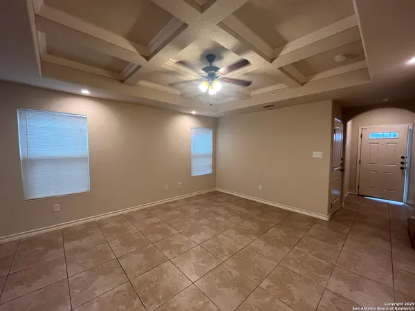 a view of an empty room and window