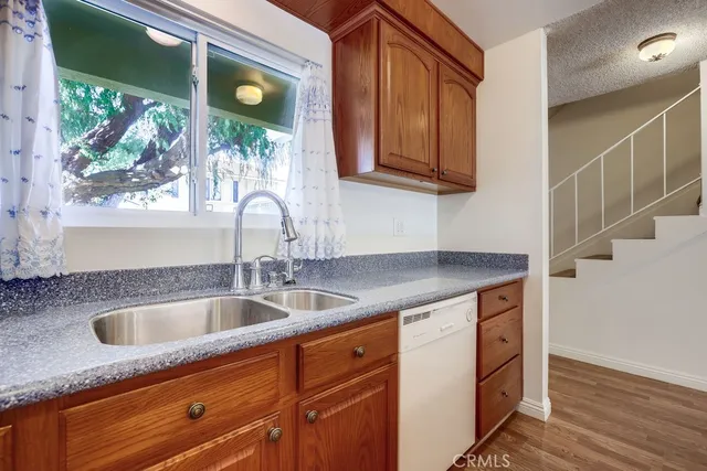 a kitchen with a sink and a window