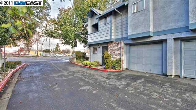 a view of a house with a street
