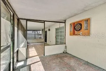 a view of an empty room with a large window