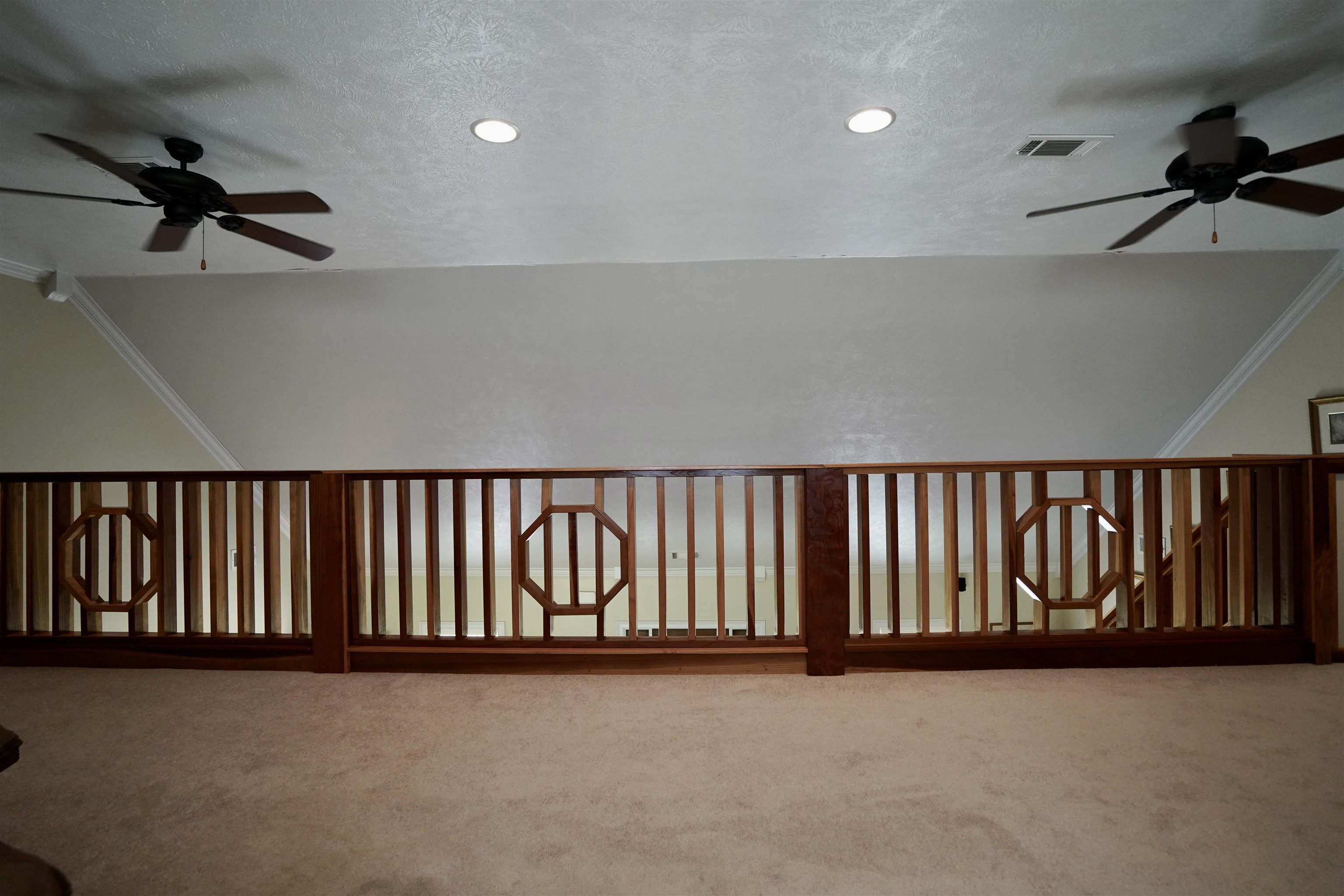 4556 Gainsville Road Mason, TN 38049 - Photo 32 of 33 Additional living space featuring ceiling fan, carpet, and a textured ceiling