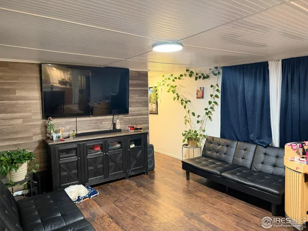 a living room with a couch and a flat screen tv
