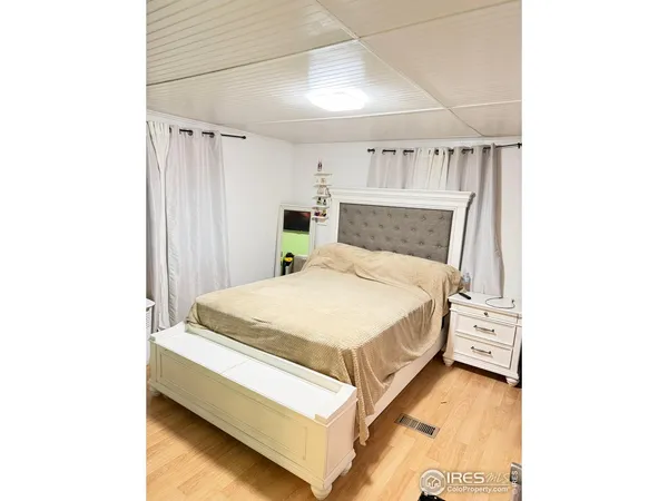 a bed room with a bed and a window