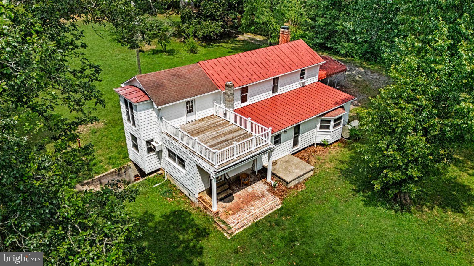 31934 Indiantown Road Locust Grove, VA 22508 - Photo 66 of 84 Charming home with a vibrant red roof.