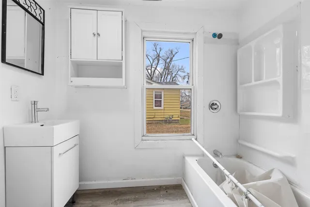a bathroom with a sink and a bathtub