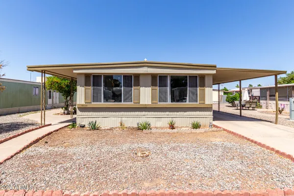 a front view of a house with a outdoor space
