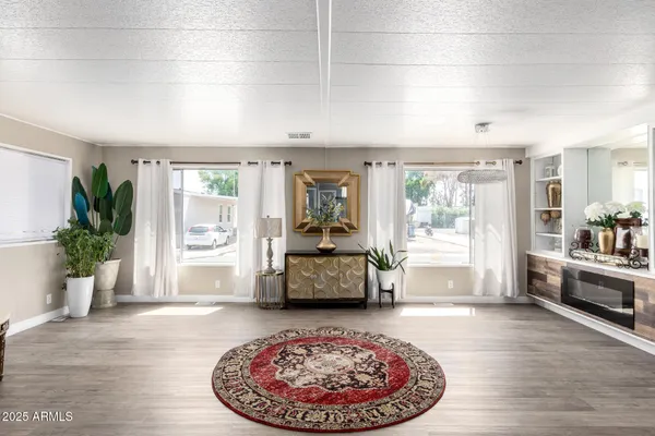 a living room with furniture and a large window