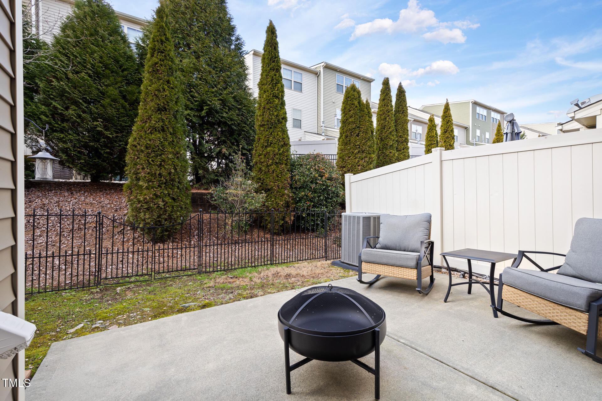 7832 Allscott Way Raleigh, NC 27612 - Photo 28 of 33 a view of a patio with a table and chairs
